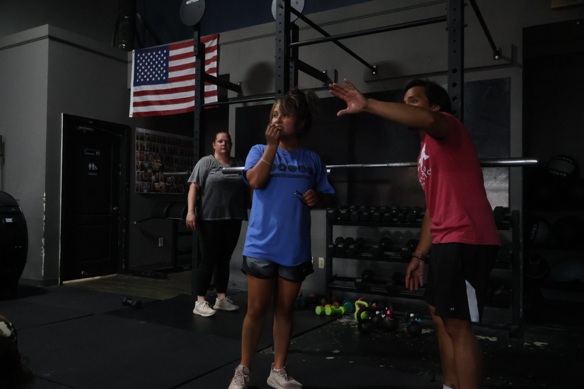 A coach guiding members during class at FTX Fort Worth